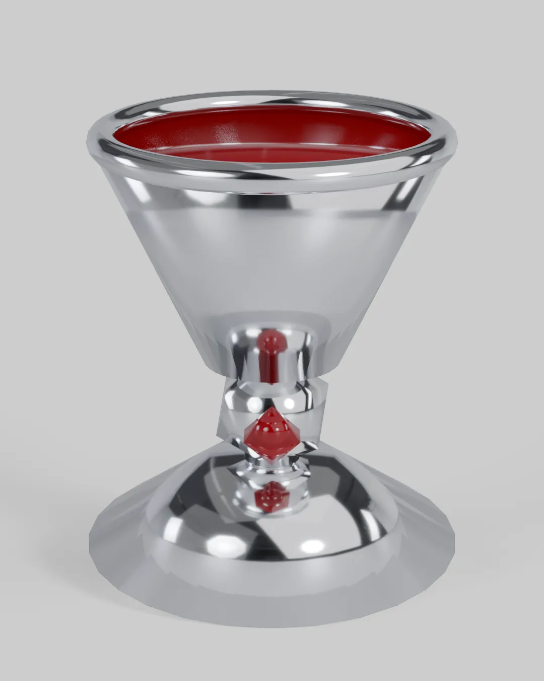 A chrome chalice holding blood-red liquid.