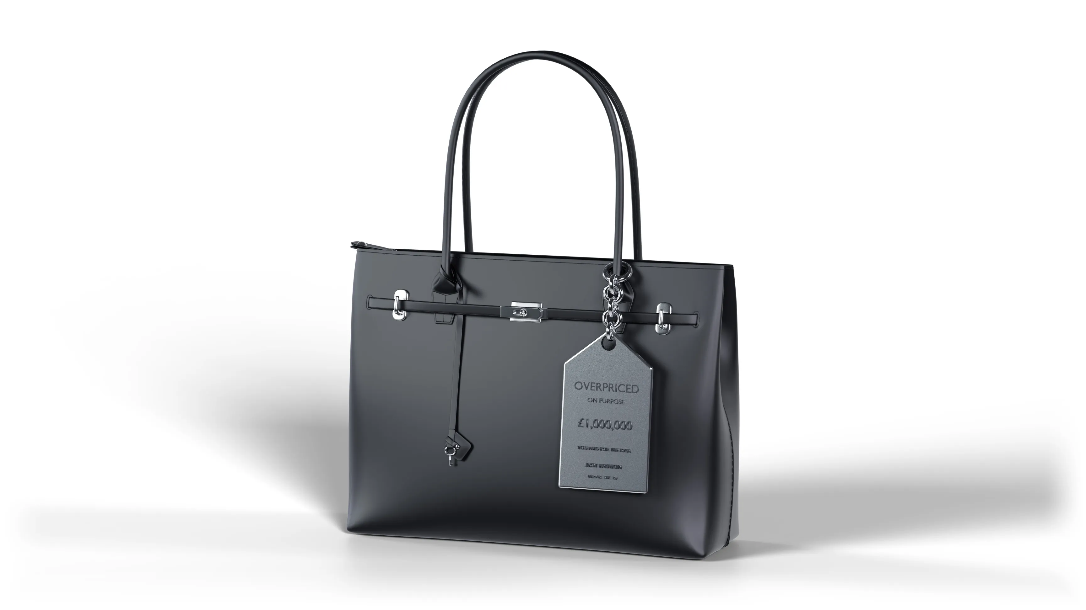 A satin steel tag hanging on a short chain from a black bag. It reads OVERPRICED ON PURPOSE, one million pounds, you paid for the idea.