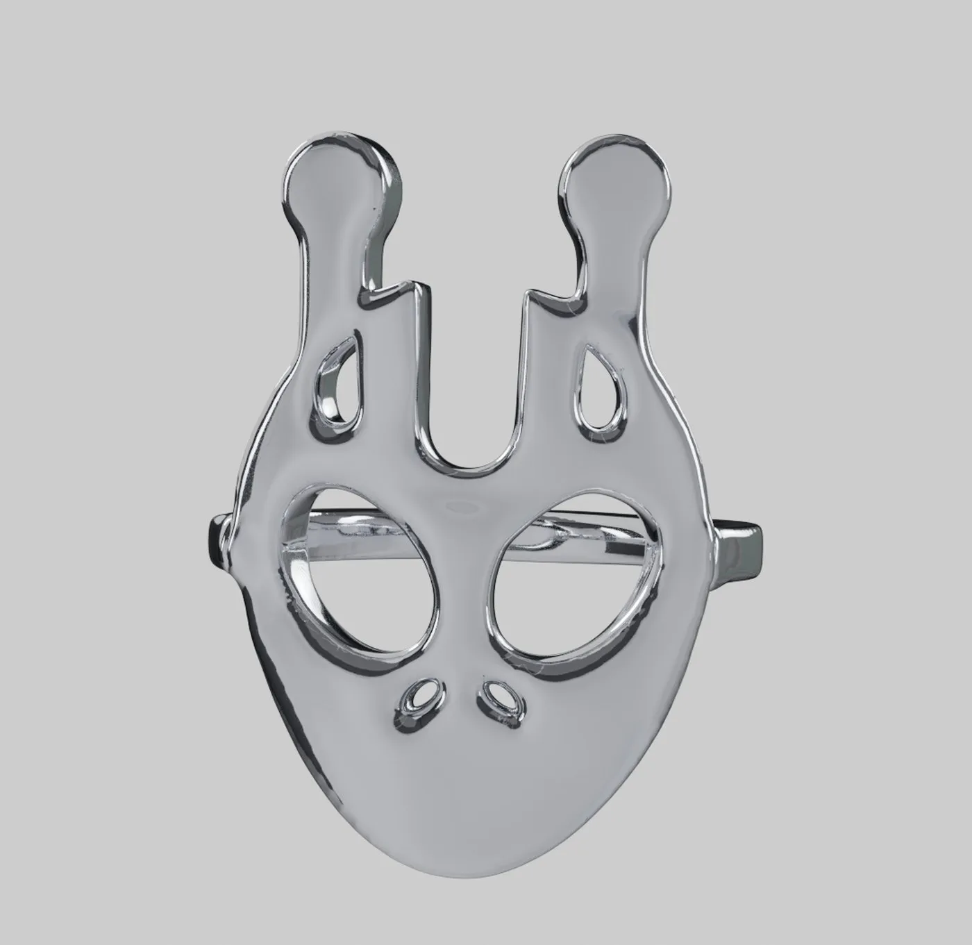 A chrome ring shaped as a face with two long ears and open eyes.