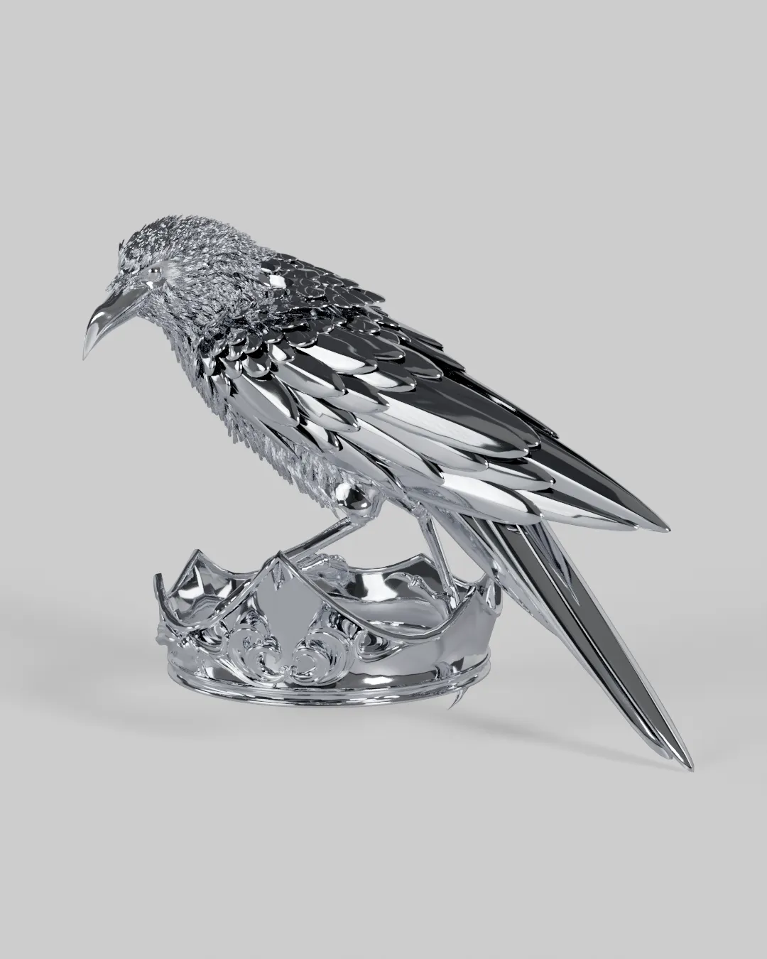A chrome raven perched on an empty chrome crown.