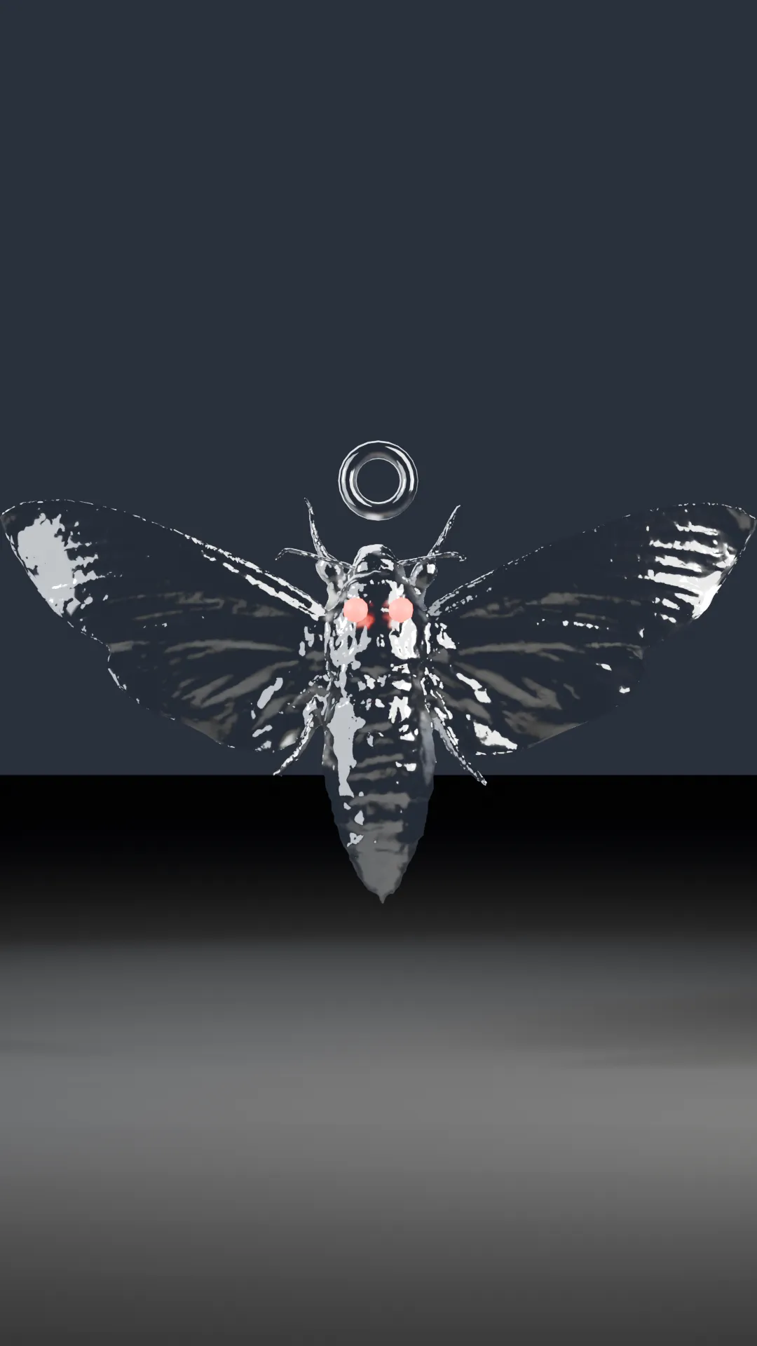A chrome death's-head hawk moth, wings spread, skull marking on the thorax.