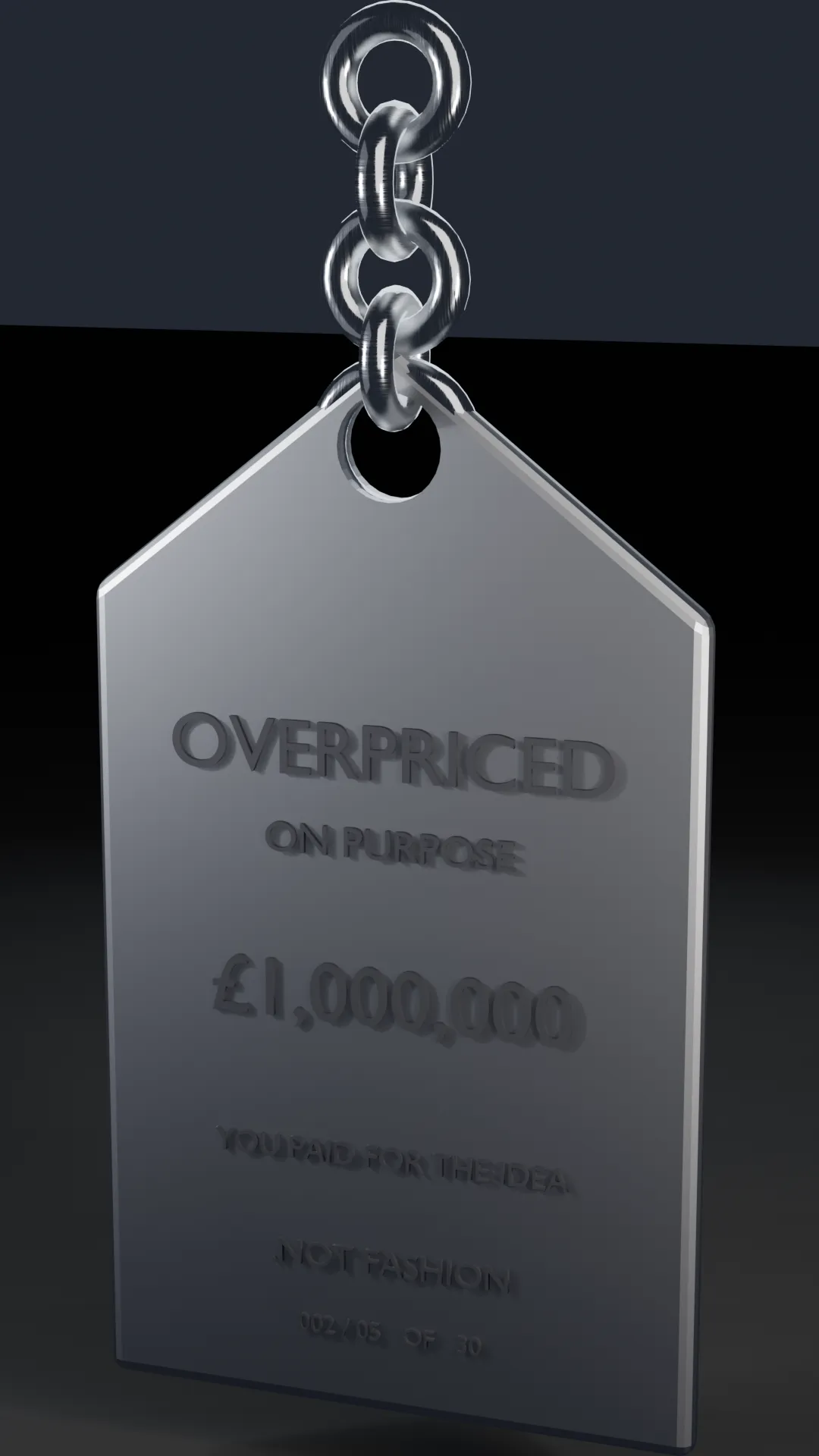 A chrome price-tag sculpture engraved OVERPRICED ON PURPOSE.