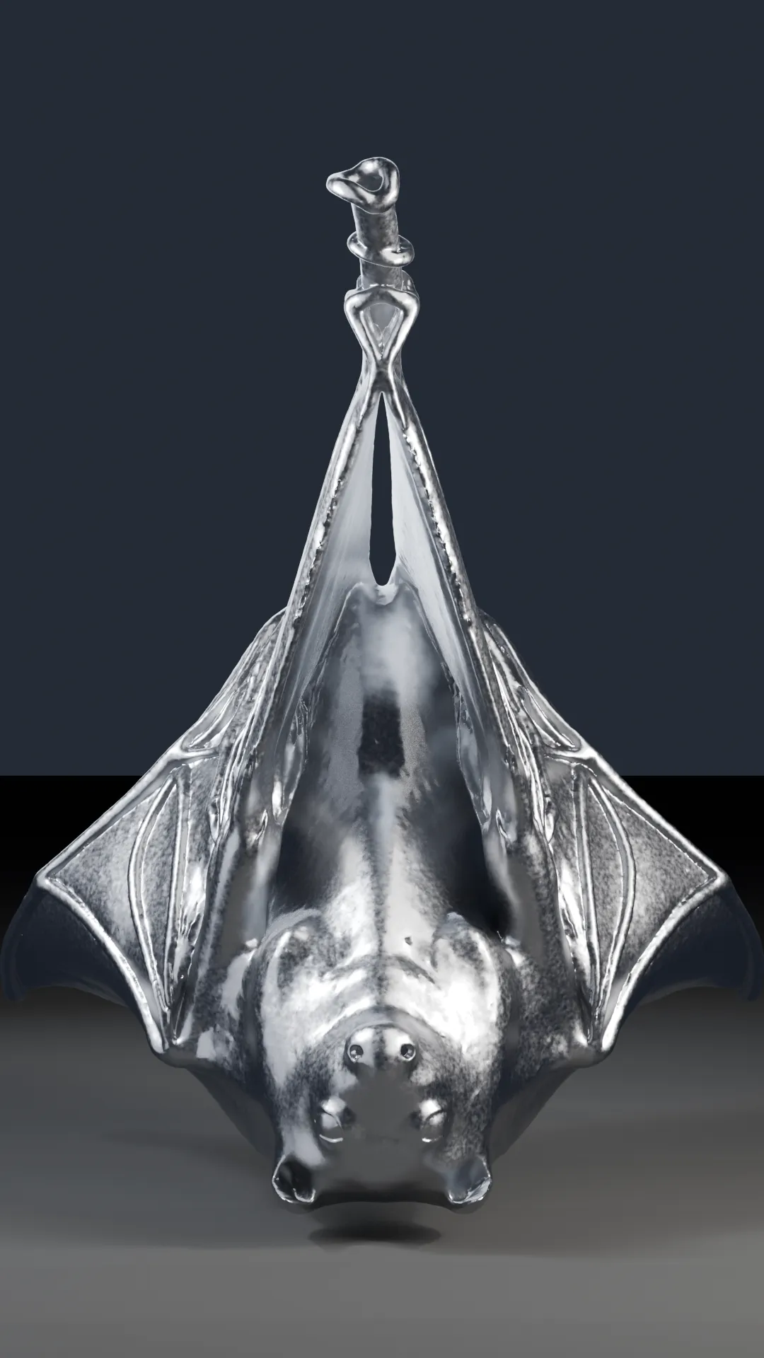 An aged, scratched-chrome bat with wings wrapped, hanging upside down.