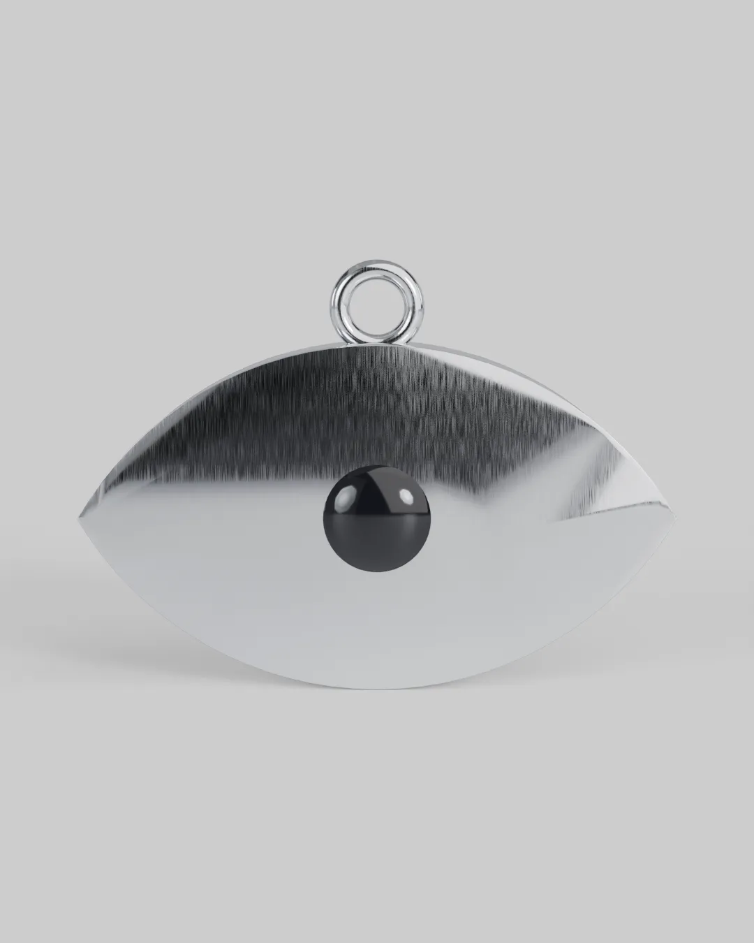 Chrome almond-shaped eye sculpture with an onyx pupil and engraved iris.